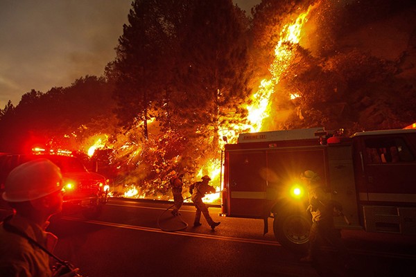 Firefighters battle the Rim Fire outside of Yosemite National Park as nears