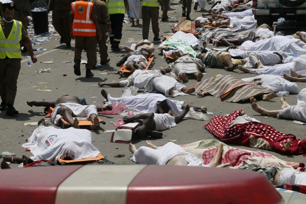 Bodies of people who died in a crush in Mina, Saudi Arabia during the annual hajj pilgrimage, are seen on Thursday, Sept. 24, 2015. Hundreds were killed and injured, Saudi authorities said. The crush happened in Mina, a large valley about five kilometers (three miles) from the holy city of Mecca that has been the site of hajj stampedes in years past. (AP Photo) ORG XMIT: CAIMA171